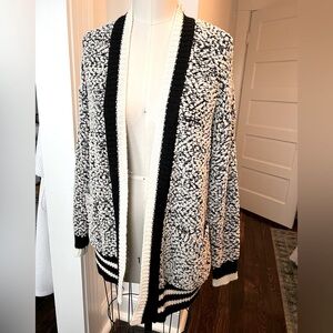 Staccato knit cardigan with varsity stripe detail and popcorn yarn.